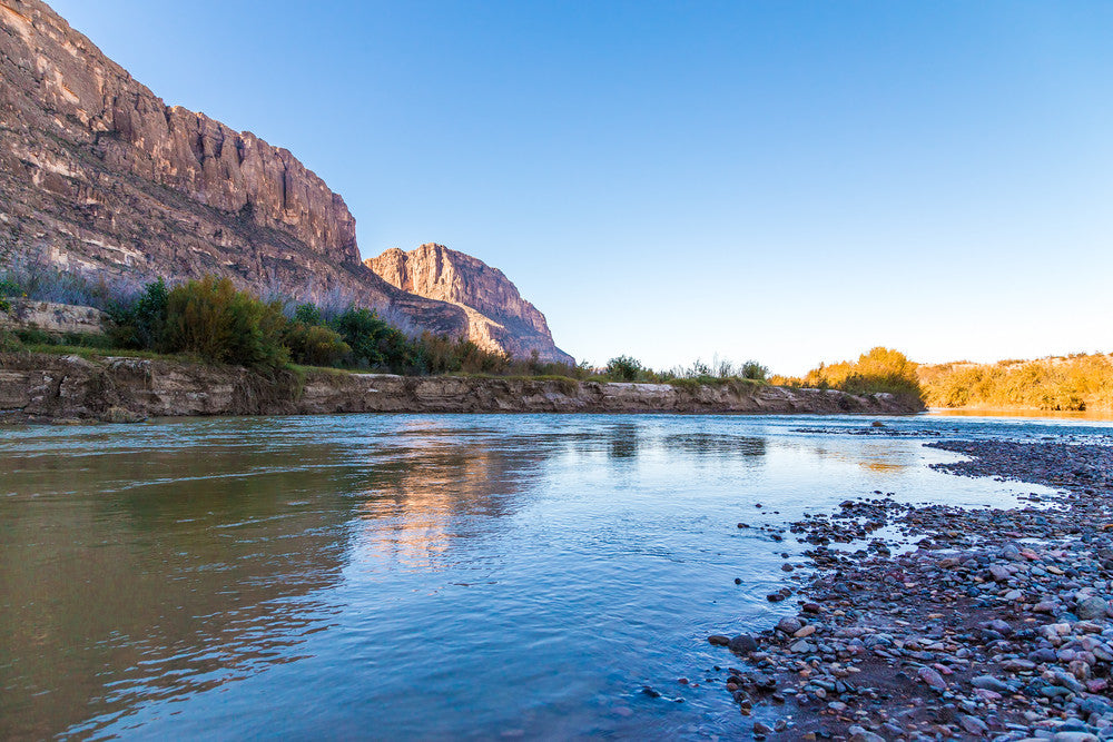 shallow river through canyon