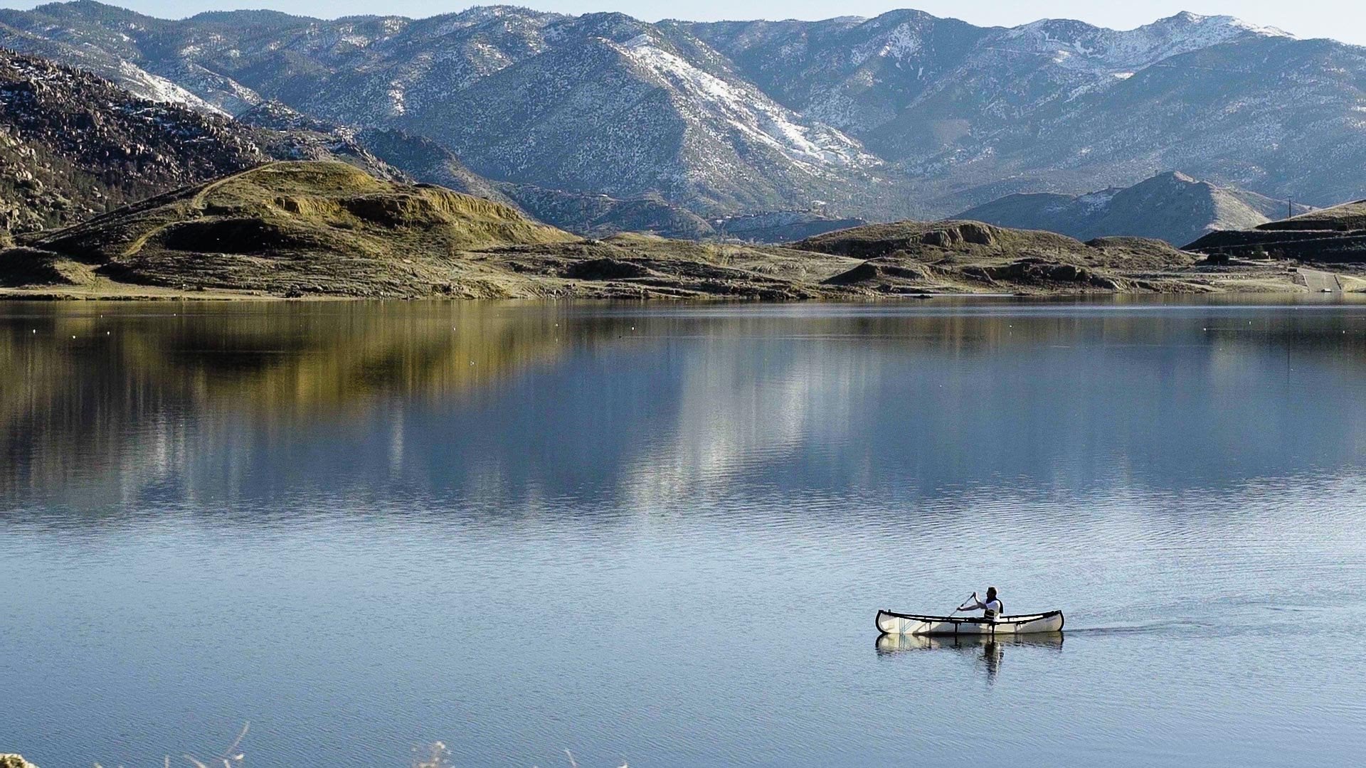 mycanoe duo two person folding canoe on still lake in mountains