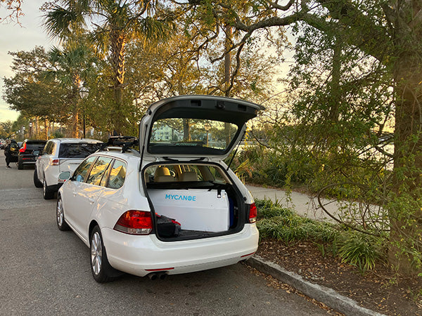 MyCanoe origami canoe folded up in the back of a white car